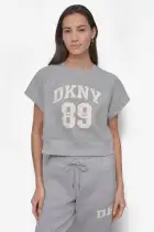 ARCHED DKNY 89 DISTRESSED RHINESTONE LOGO CROPPED